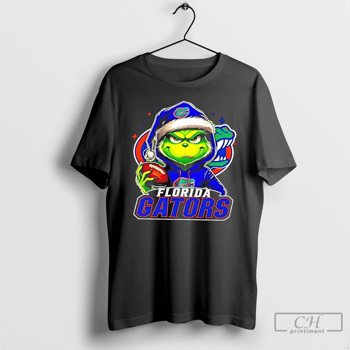 Premium Grinch Is Holding A Ball And Smiling At Florida Gators Fans Christmas T Shirts