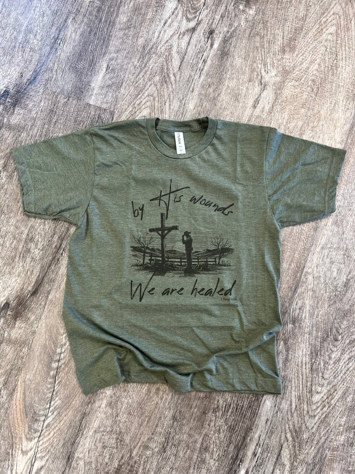 By His Wounds We Are Healed On Tultex Heather Military Green