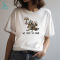 Raccoon carrying lamp and backpack items We Thrift at Dawn t shirt