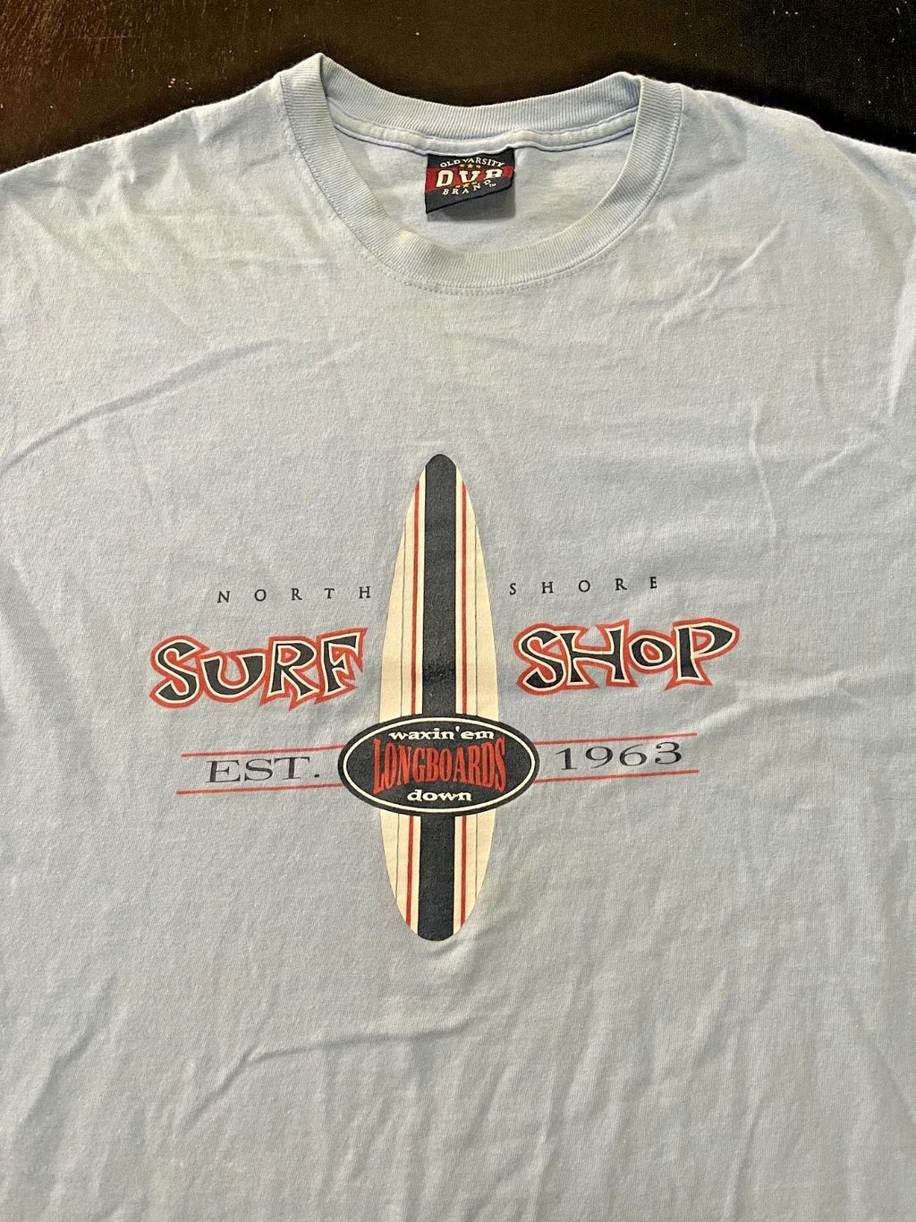 North Shore Surf Shop Waxin'em Longboards Down T-Shirt, Light Blue, Size: XL