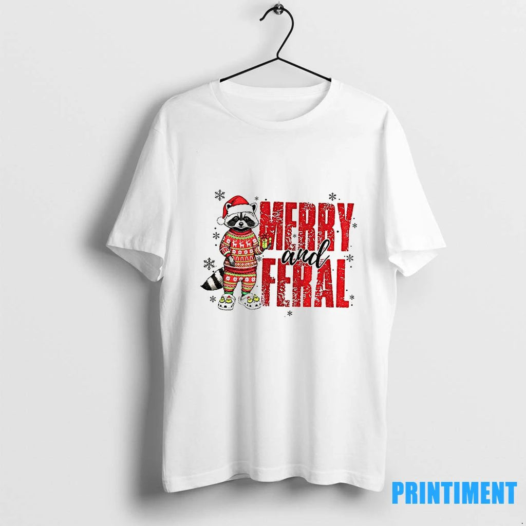 Funny Raccoon Santa Hat Merry And Feral Merry Christmas 2025 Tshirts Sweater