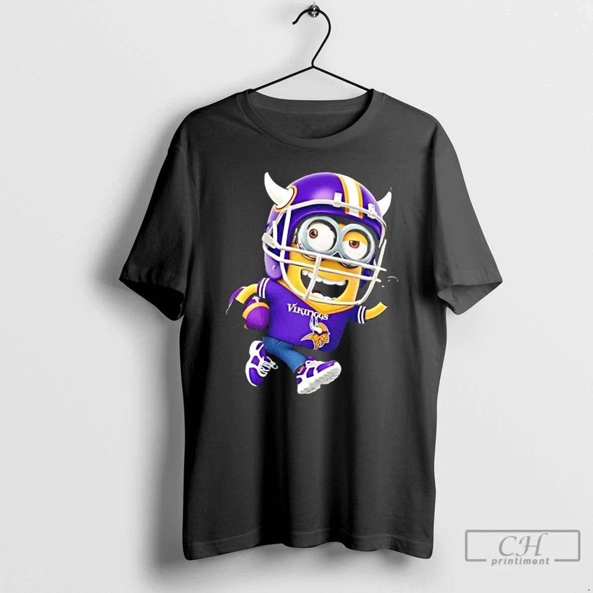 Premium Minions Is Holding A Ball And Smiling At Minnesota Vikings Fans T Shirts