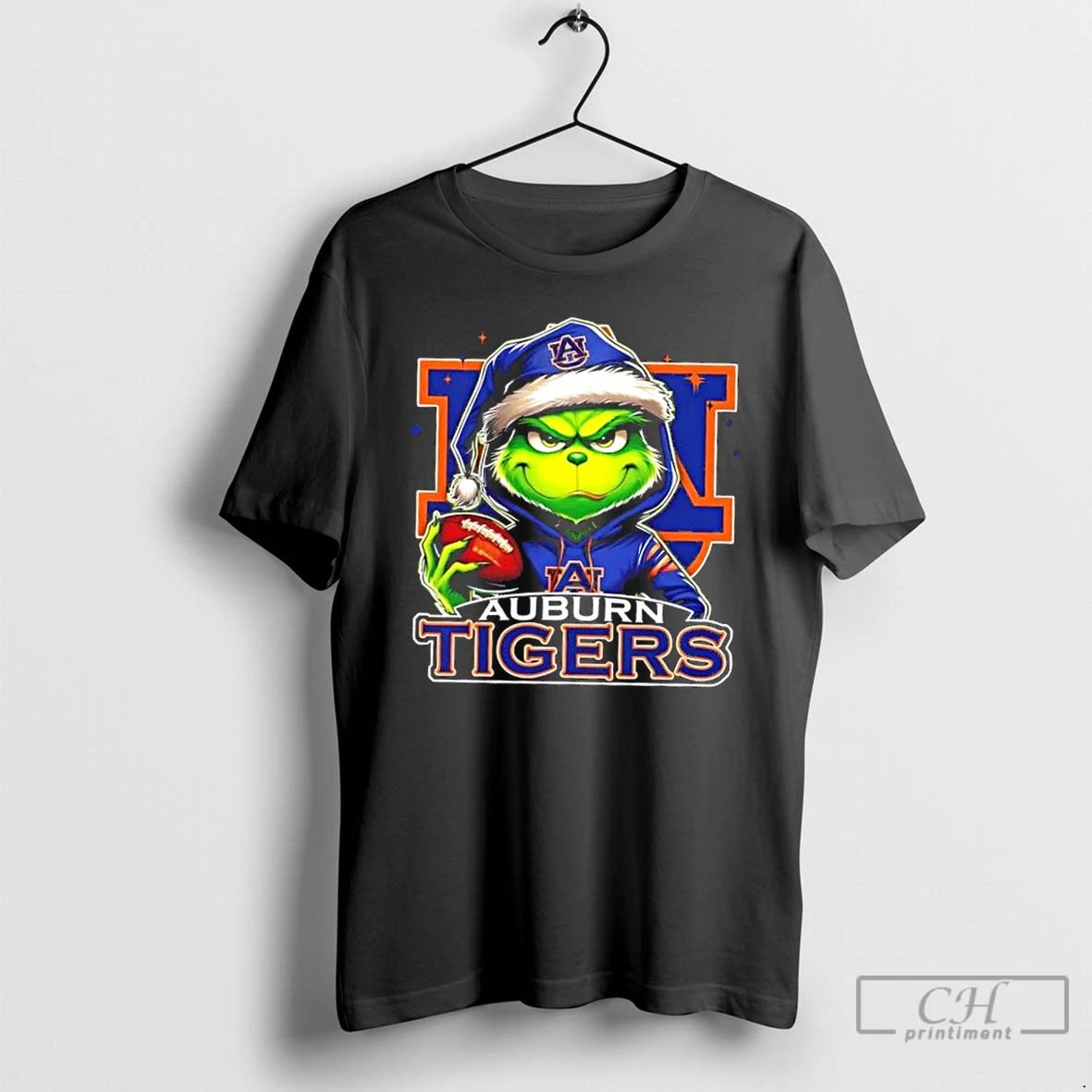 Premium Grinch Is Holding A Ball And Smiling At Auburn Tigers Fans Christmas T Shirts